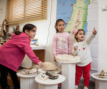 Photo of three girls playing. Links to Gifts of Life Insurance